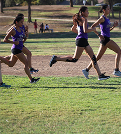 students running on the grass